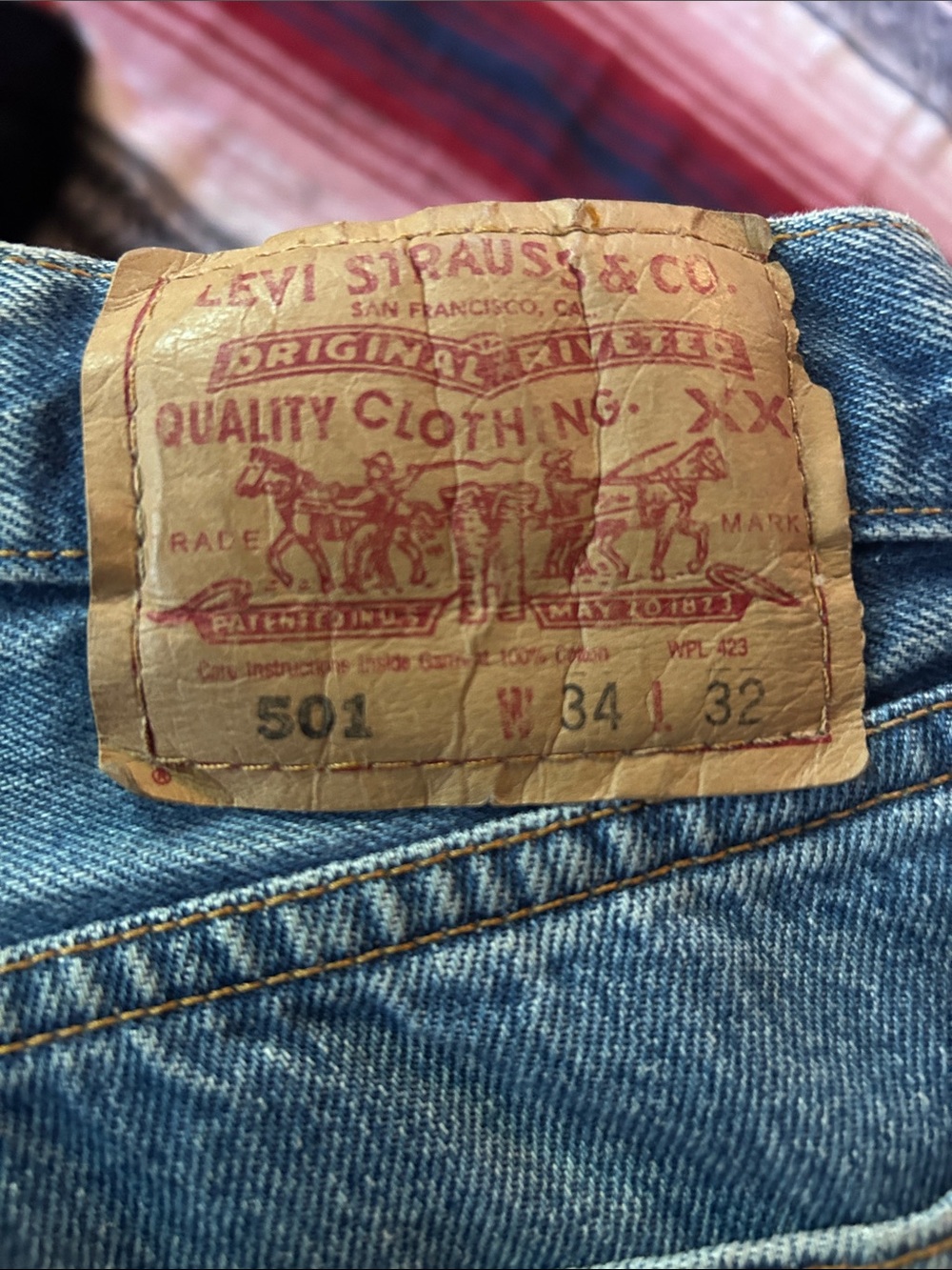 Levi's 501 Straight Leg button fly Jeans in light blue with tan patch